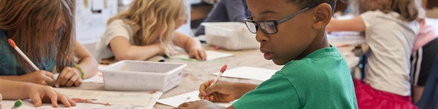 Several children at their school desks