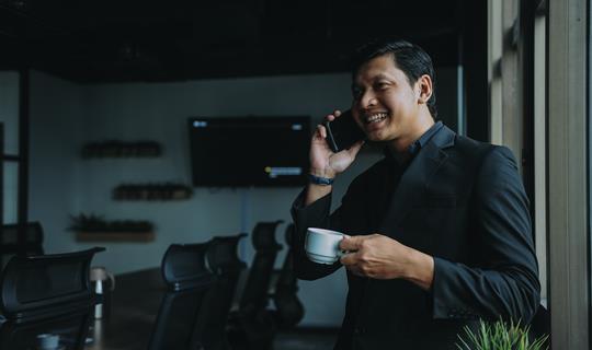 A business man speaking on a mobile phone