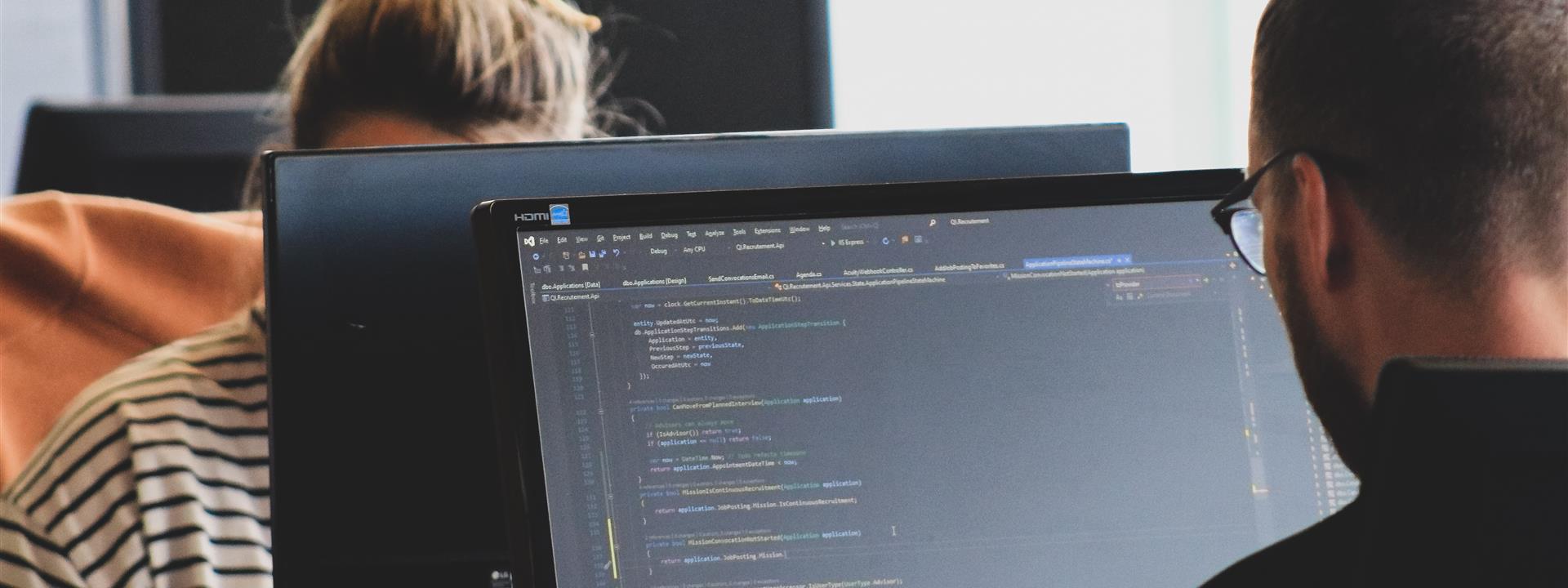 a man working on code on a computer