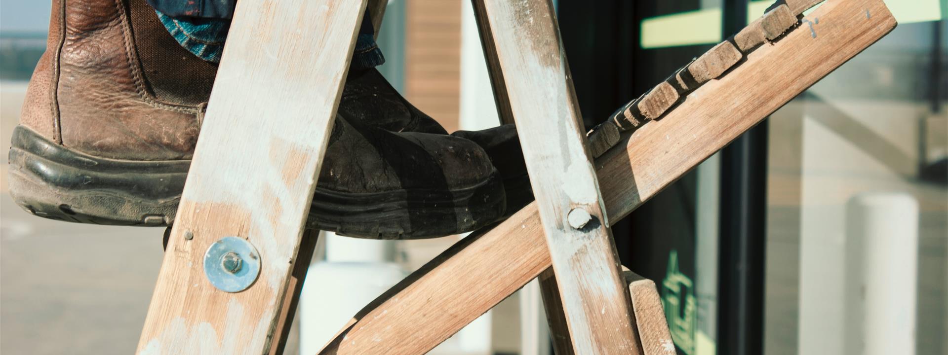 a close up of a boot on a ladder