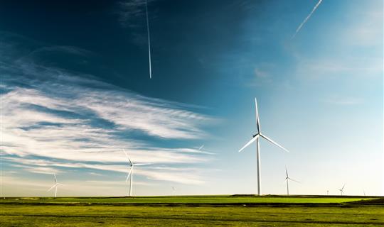 several wind turbines in a field