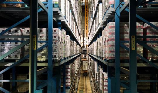 a large warehouse with high shelves